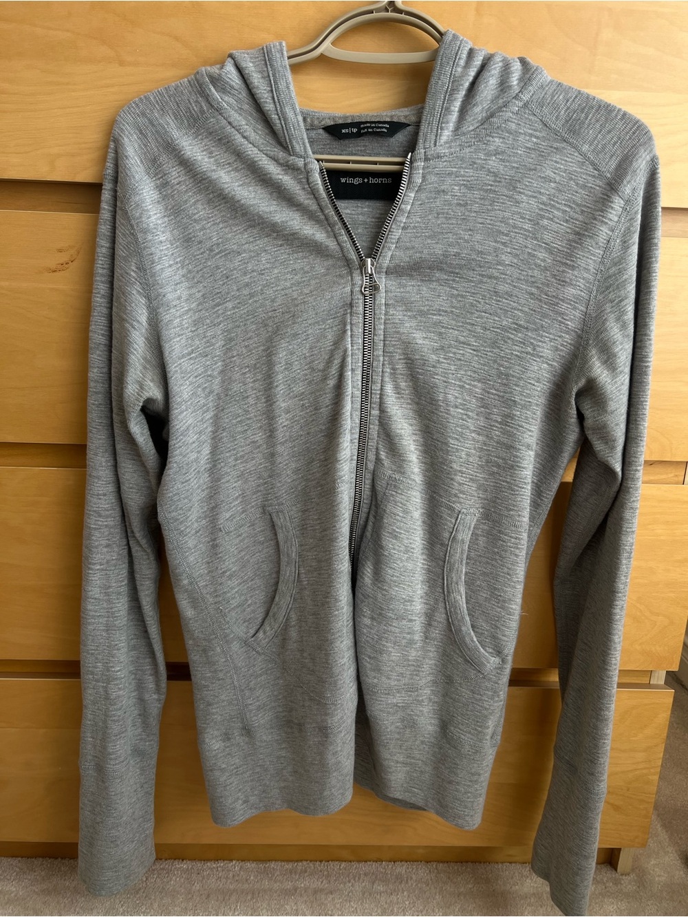 Wings + Horns light gray zip-front hoodie, made in Canada